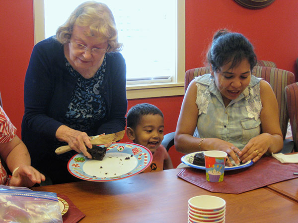 Members having cake at the church