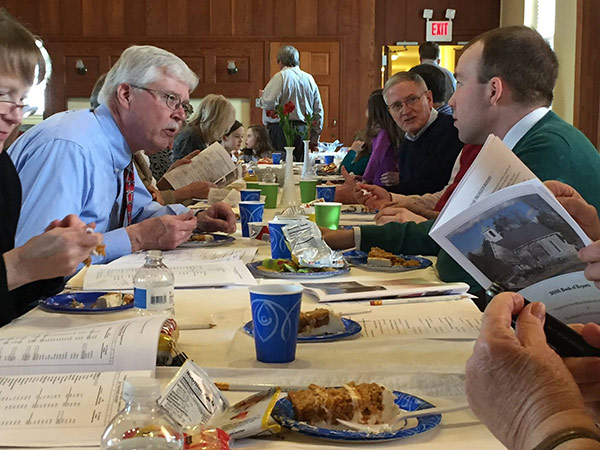 Pastor Loring having a meal with BCGV members