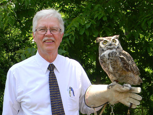 Pastor John Loring holding an owl