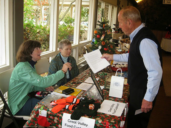 BCGV Food Cupboard staff sitting at a table