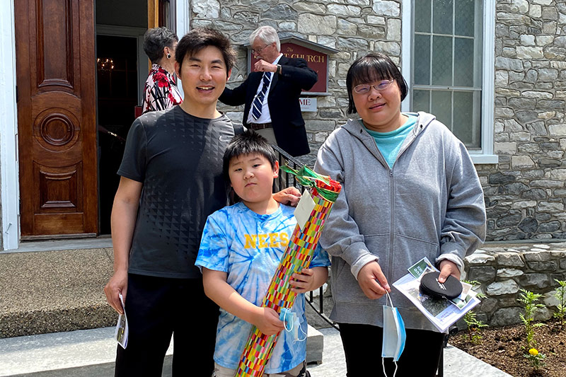 Church members outside the church after services