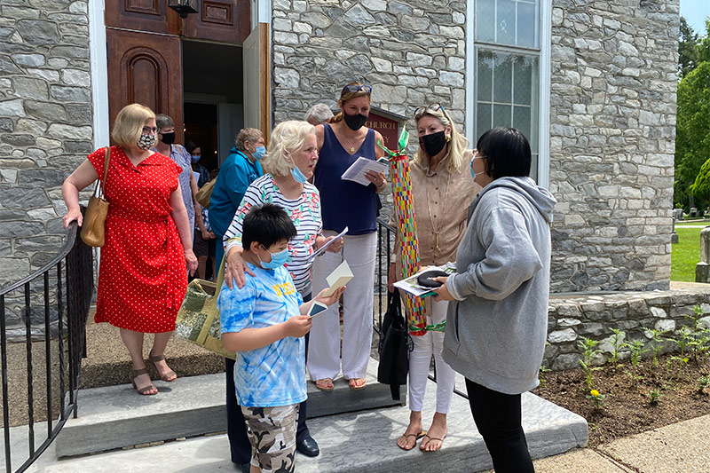 Church members outside the church after services