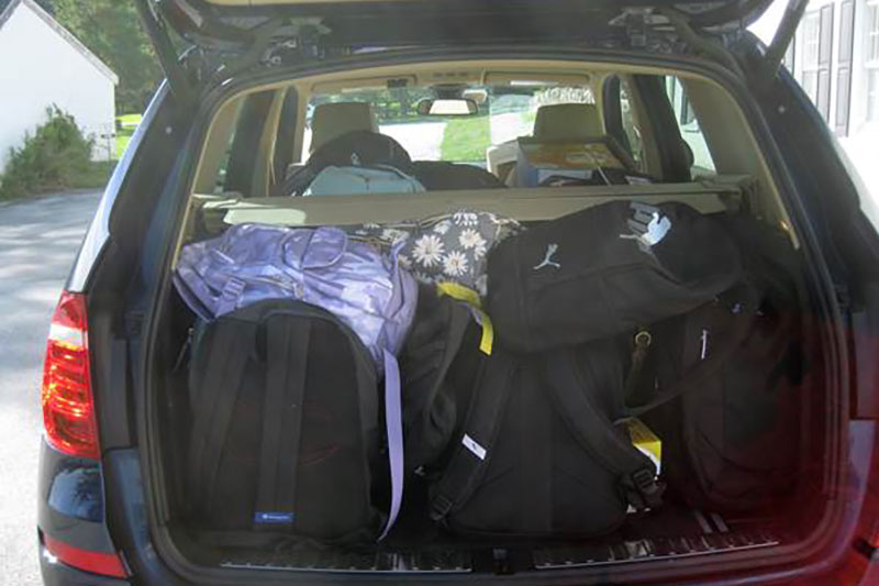 Photo of food cupboard backpacks in a car