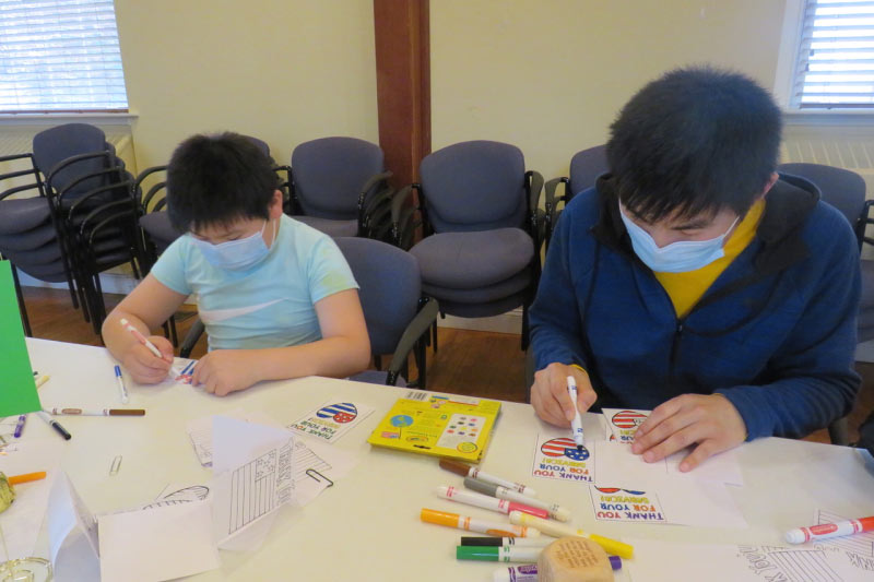 Photo of two boys doing arts and crafts