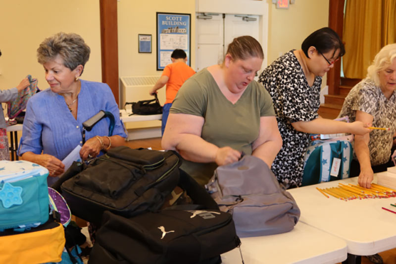 Photo of people packing backpacks