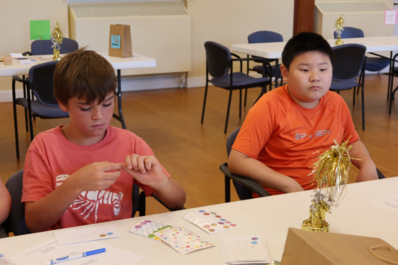 Photo of kids doing arts and crafts