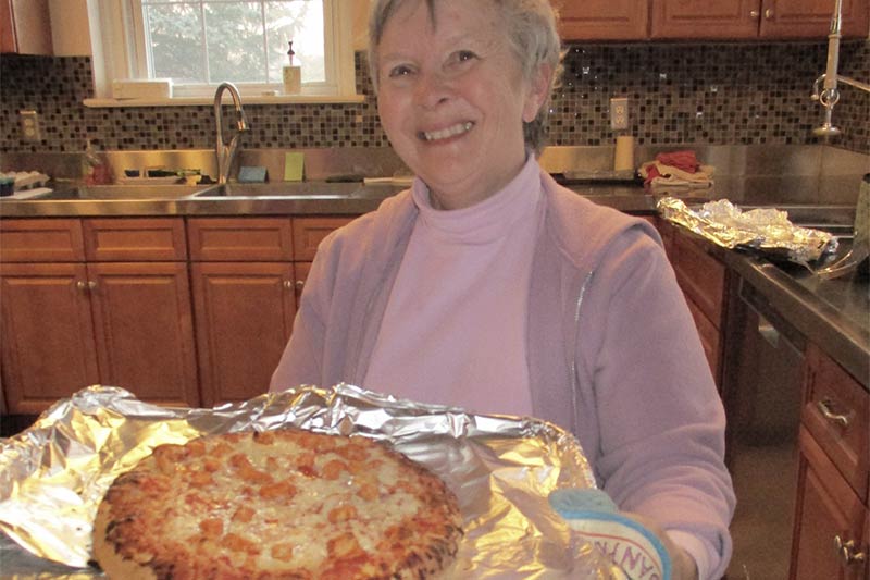 Photo of Roberta with Pizza for Shazzam