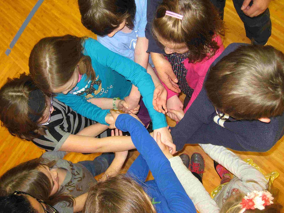 Photo of children with all hands in