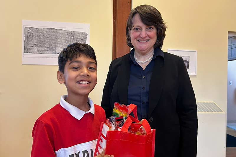 Photo of Karen Smith and little boy holding a gift bag