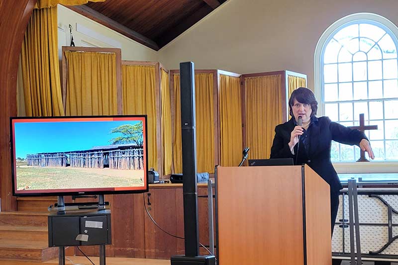 Photo of Karen Smith speaking at a podium