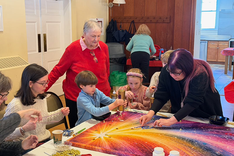 Photo of people making a black history art project