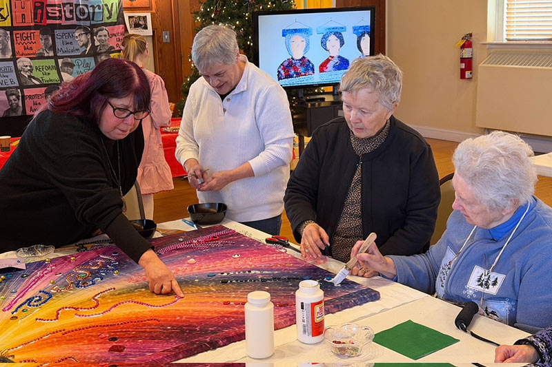 Photo of people making a black history art project