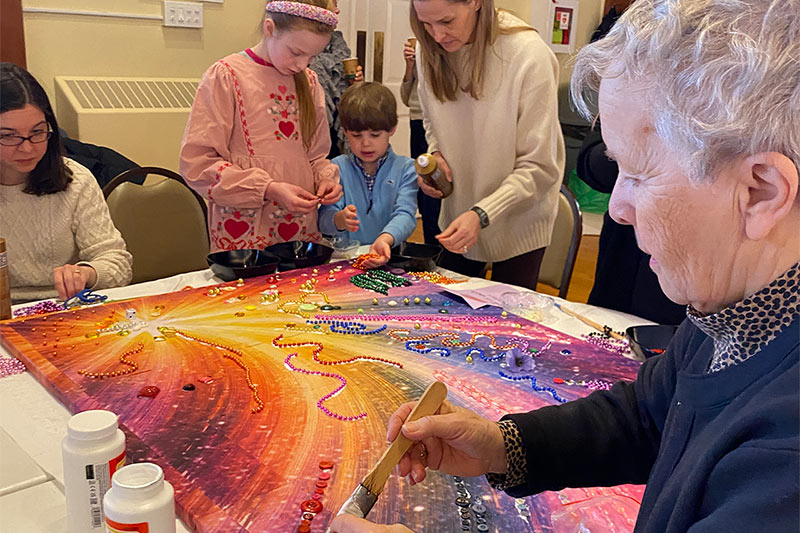 Photo of people making a black history art project