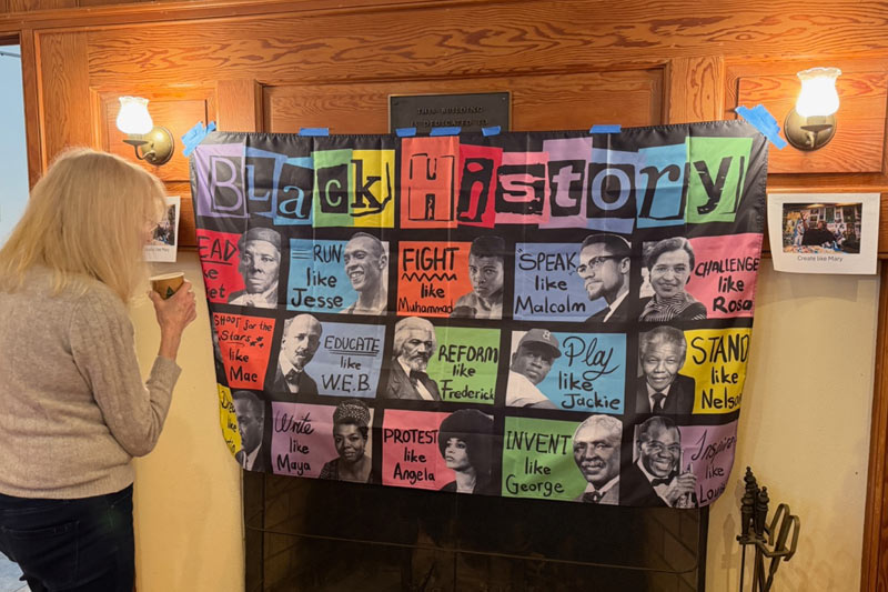 Photo of a woman looking at a Black History display